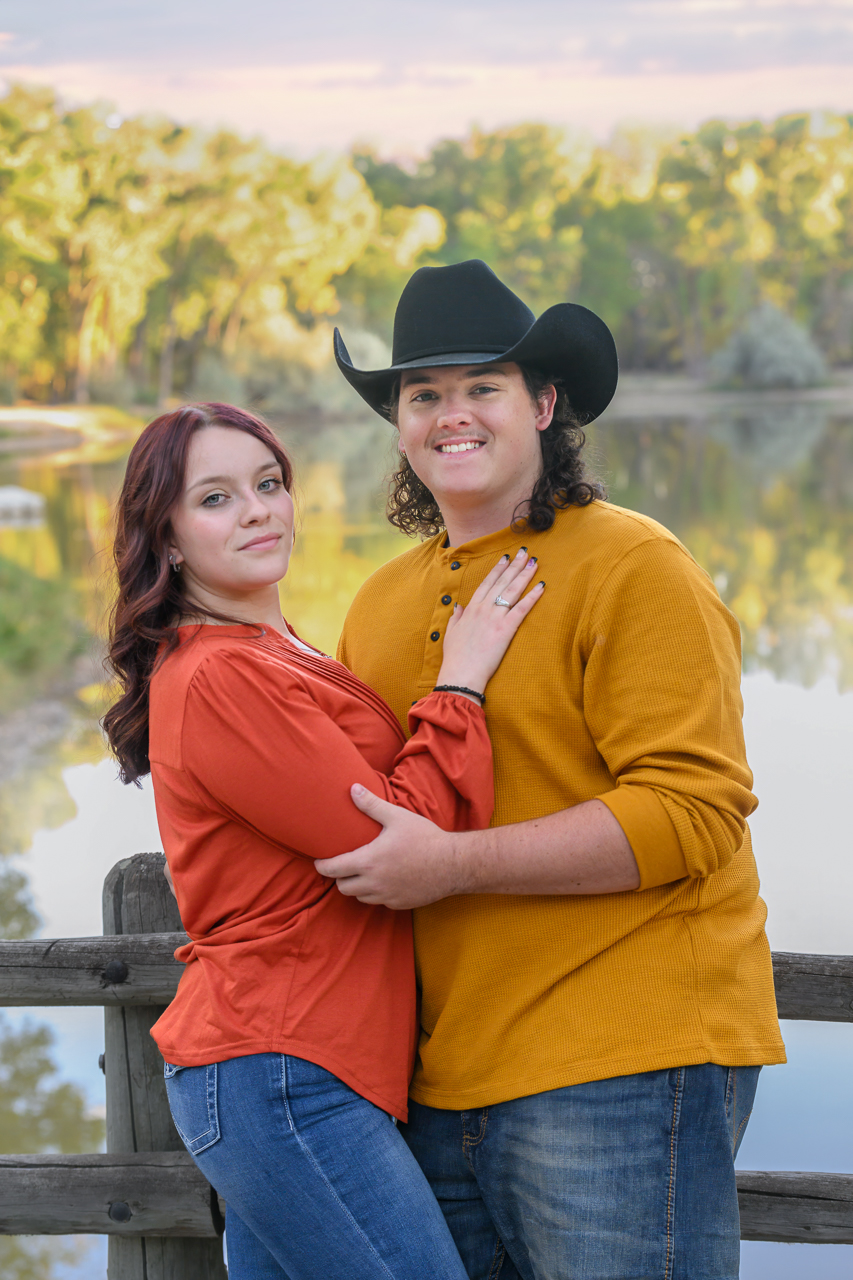 couple spring Young couple during outdoor family photo session in North Ogden Utah, smiling near a river at sunset